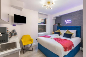 Urban Spectrum Vibrant Studio with Kitchenette